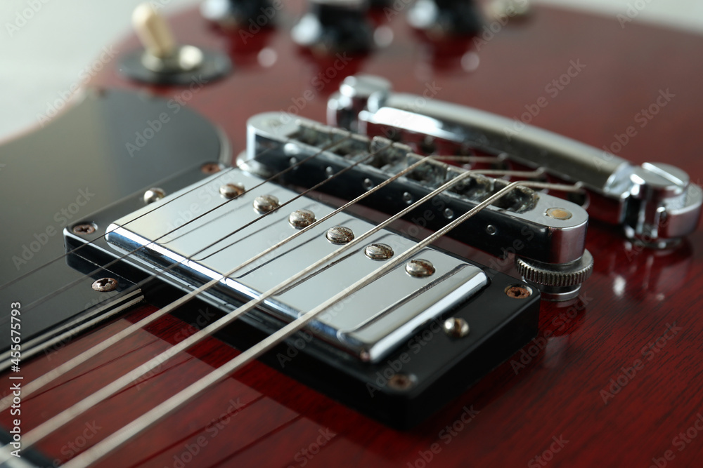 Fototapeta premium Red electric guitar, close up and selective focus