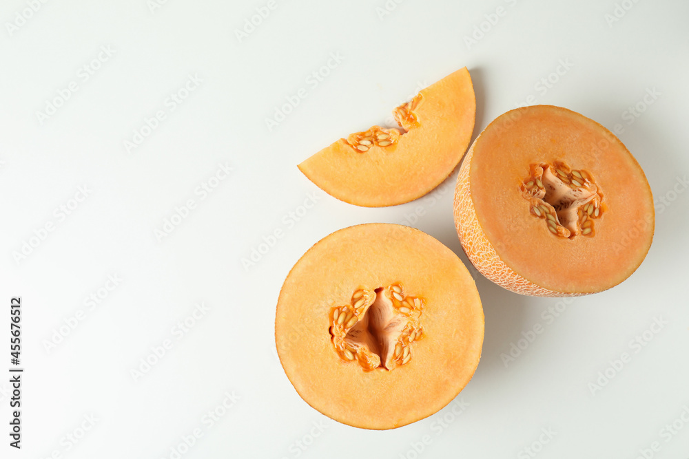 Ripe melon slices on white background, top view