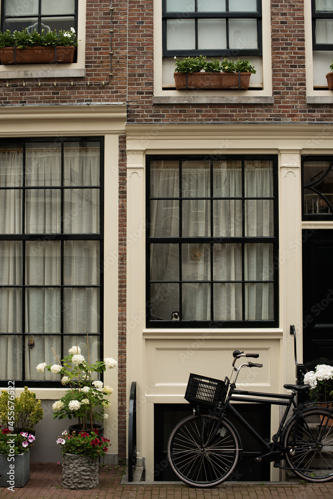 bicycle in front of a house in Amsterdam bicycle in front of a house in Amsterdam