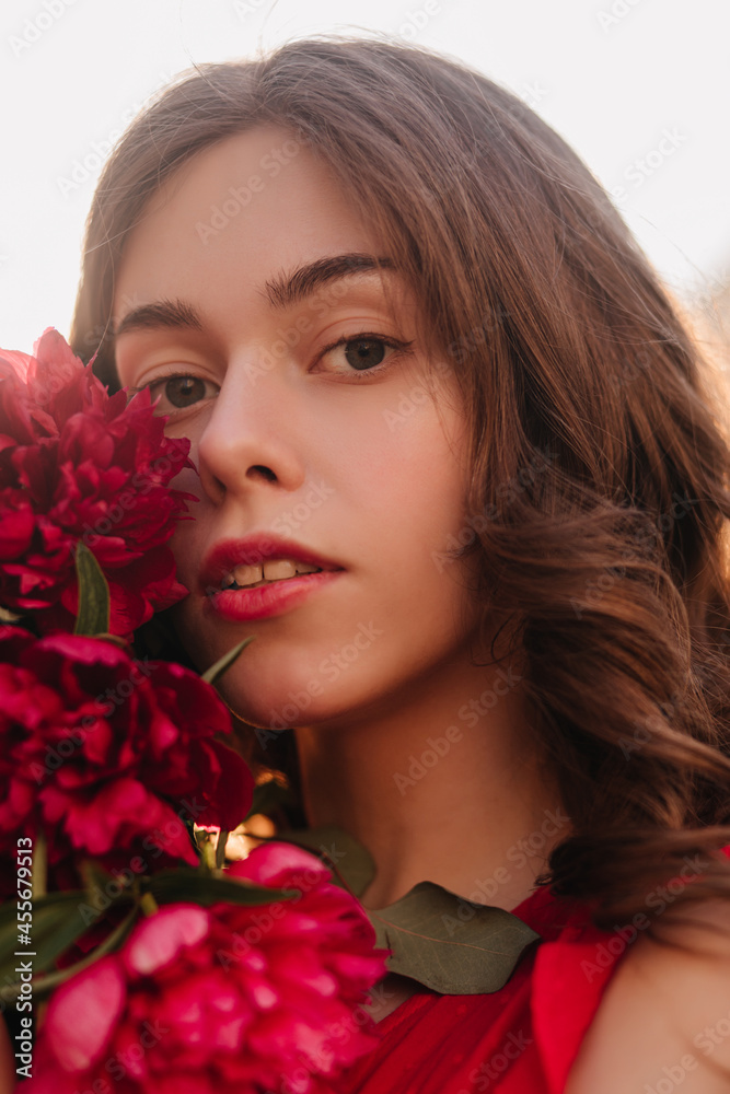 Portrait of a natural and modest girl in red, with magic eyes and lovely flowers. her delicate skin is perfectly matched with neat makeup, scarlet lipstick a delicate dress Portrait of a natural and modest girl in red, with magic eyes and lovely flowers. her delicate skin is perfectly matched with neat makeup, scarlet lipstick a delicate dress