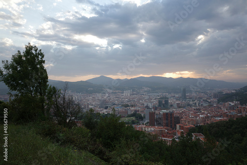 Bilbao seen from a hill in a summer cloudy day