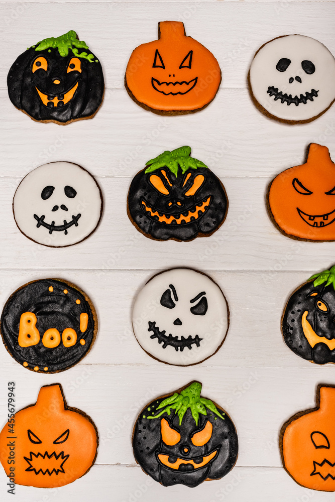 top view of homemade and tasty halloween cookies on white surface top view of homemade and tasty halloween cookies on white surface