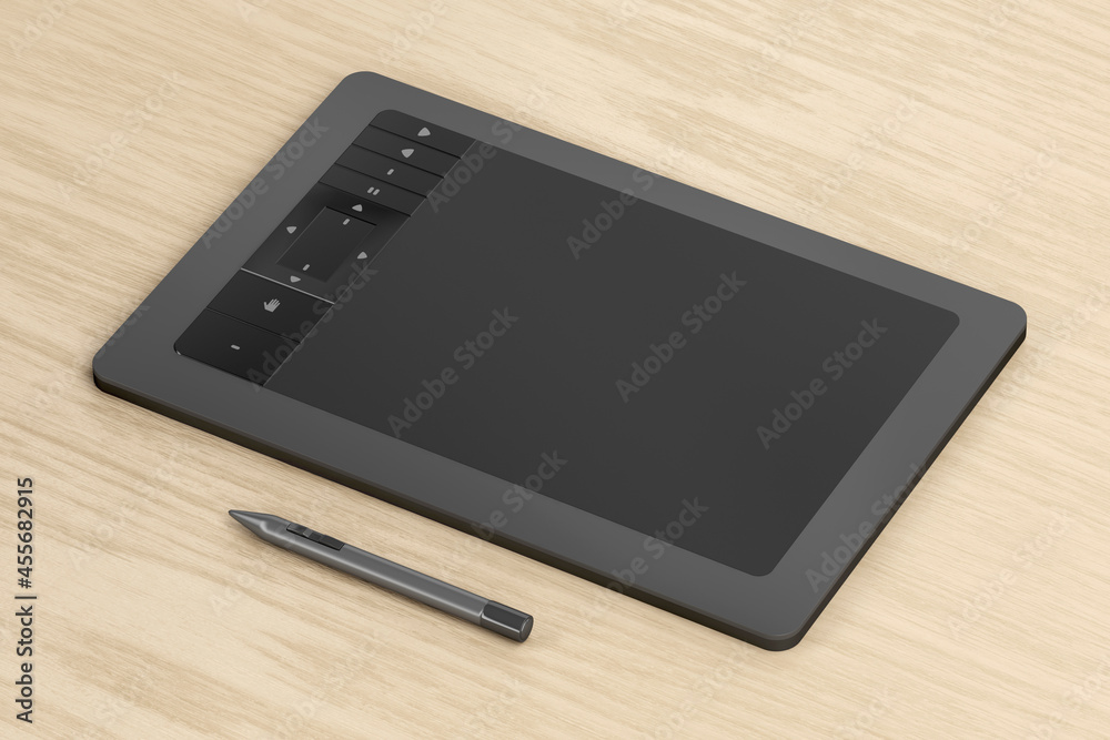 Drawing tablet with pen on wooden desk Drawing tablet with pen on wooden desk