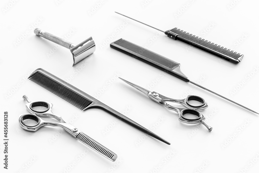 Barber tools with hairdressing scissors and combs Barber tools with hairdressing scissors and combs