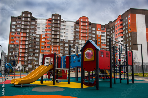 The playground on houses background © Александра Замулина