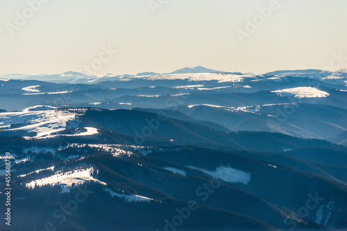 Beautiful alpine panoramic view of mountains covered with snow