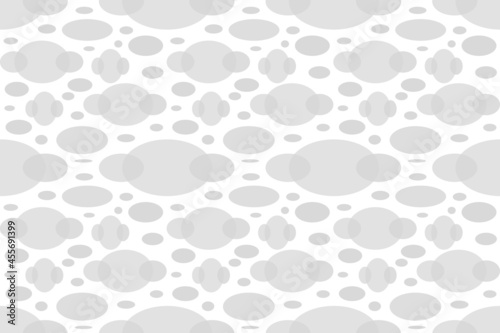 Seamless abstract wallpaper with cute patterns, translucent gray ovals of various sizes tiled on a white background. photo