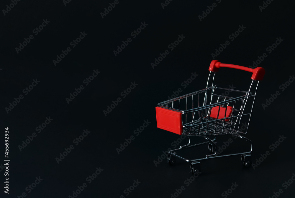  shopping cart  or trolley on black background with copy space.