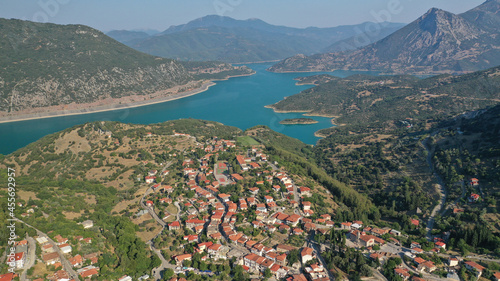 Aerial drone photo of small picturesque village of Lidoriki built near lake and dam of Mornos a clean water supply for Attica, Greece © aerial-drone