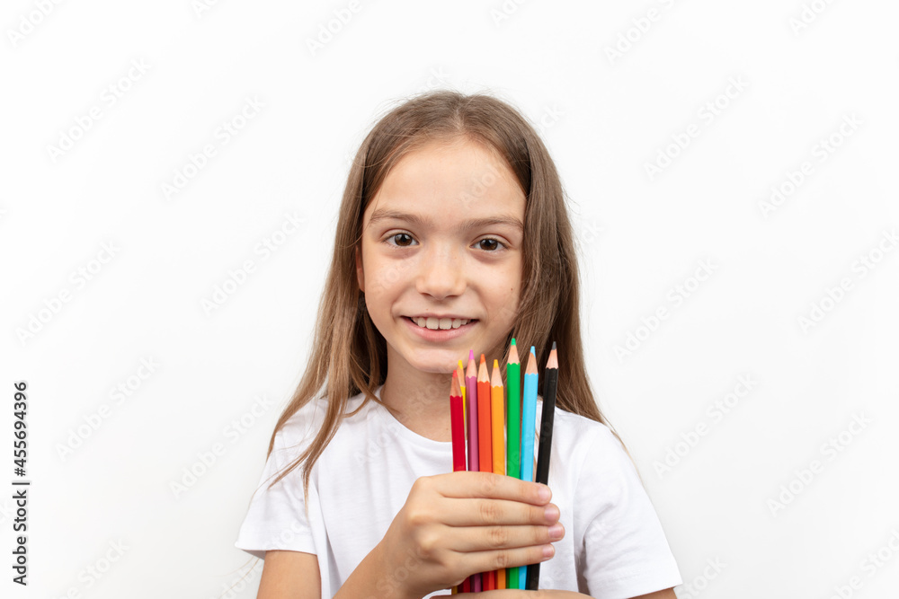 education and creativity concept. Little student girl with colorful crayons on white background. education and creativity concept. Little student girl with colorful crayons on white background.