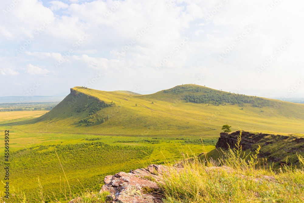 Summer landscape of the Sunduki mountain range located in the valley of the Bely Iyus River in Khakassia, Russia. Mountain view the Third Sunduk