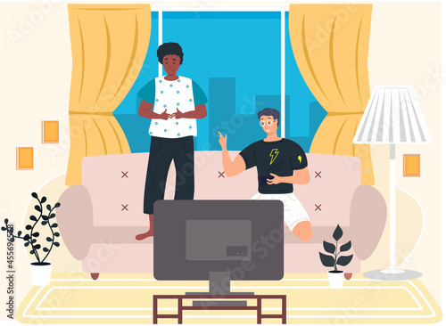 Two boys playing computer video games sitting on couch with gamepad relaxing at home, young people having good time, spending weekend together indoor. Fun leisure time with friends, entertainments