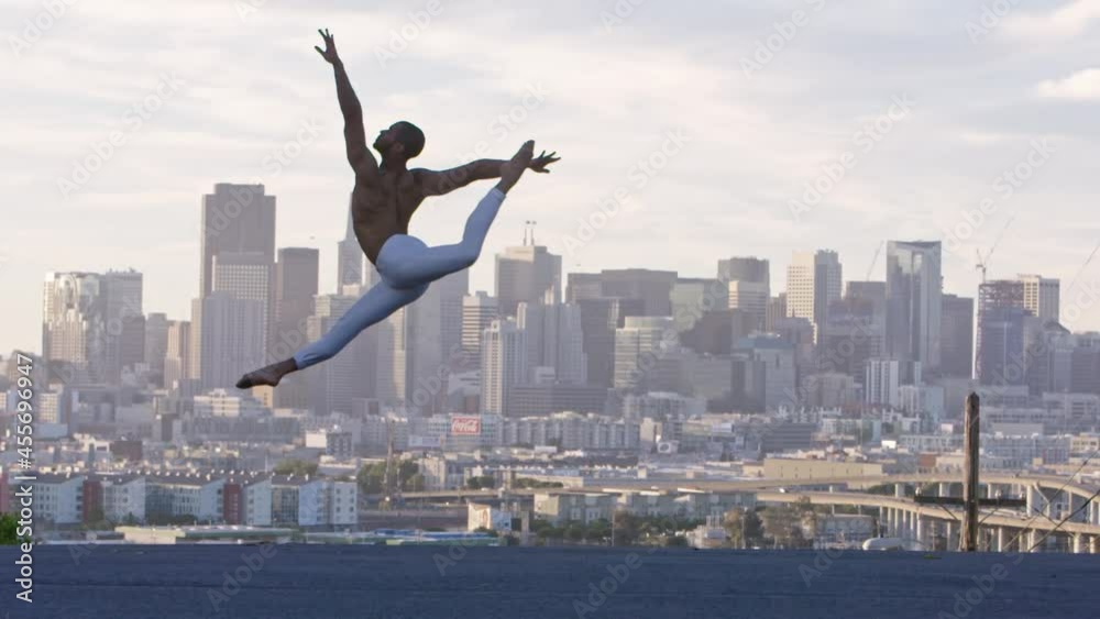 Graceful ballet dancer jumping and twirling in the air. San Francisco Graceful ballet dancer jumping and twirling in the air. San Francisco