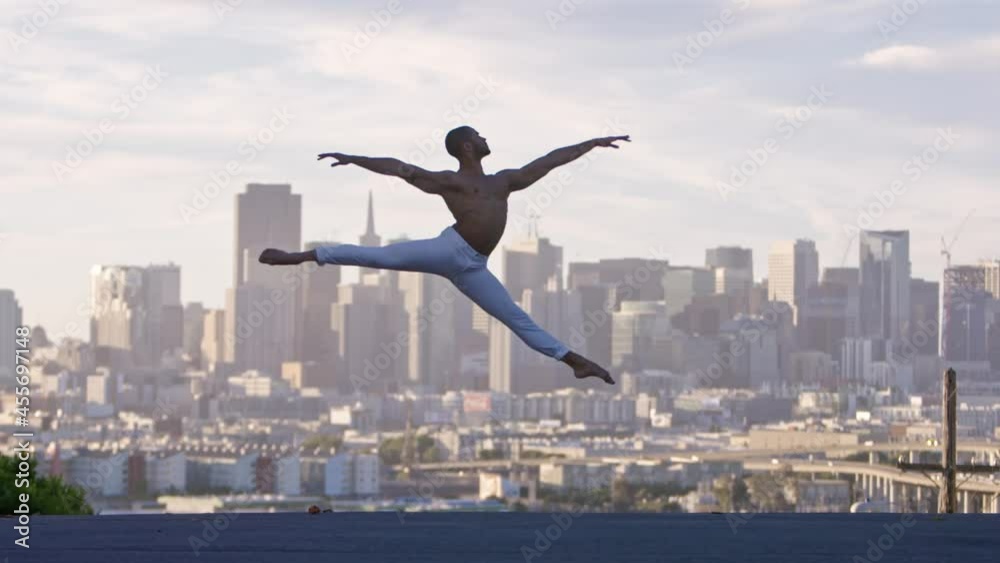 Graceful ballet dancer jumping and twirling in the air. San Francisco Graceful ballet dancer jumping and twirling in the air. San Francisco