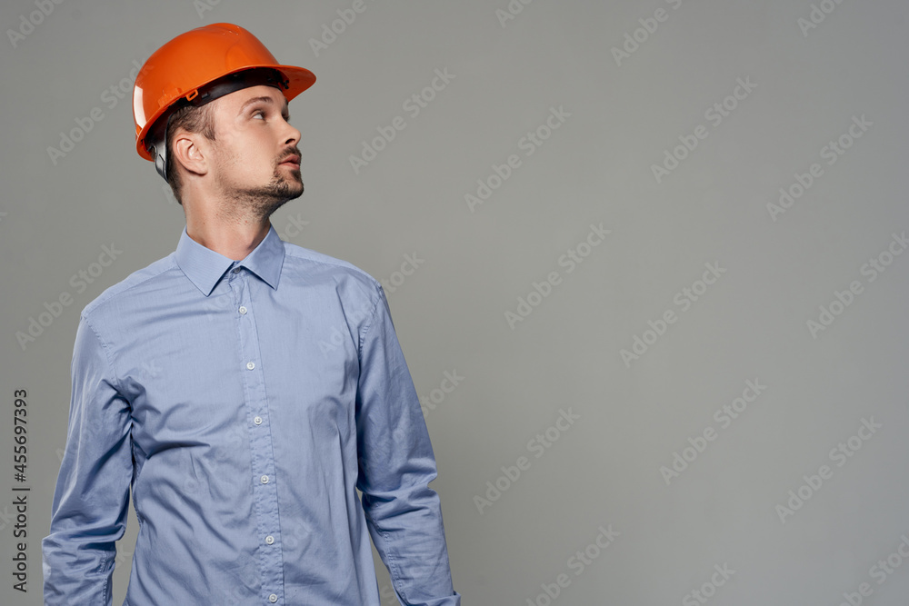 Man orange helmet engineer safety isolated background Man orange helmet engineer safety isolated background