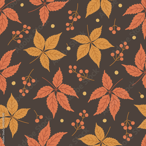Autumn seamless pattern with virginia creeper leaves and berries. Vector illustration on brown background. Fall ornament. Foliage print for fabric, package, wrapping, wall art. Red, orange colors.