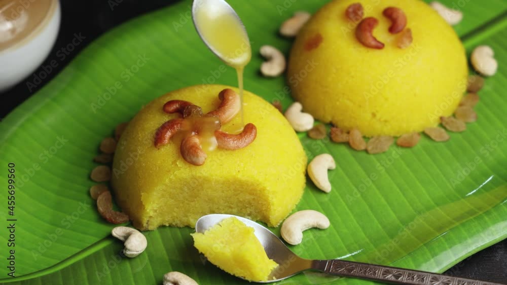 pouring ghee Rava kesari Kesari bath sheera suji halwa Indian sweet