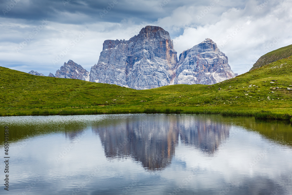 Majestic landscape of mountain lake with Dolomites mountain peak in background in Eastern Dolomites, Italy Europe. Beautiful nature scenery and scenic travel destination
