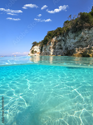 Underwater sea level split photo of beautiful paradise turquoise exotic beach of Voutoumi probably the best in Greece  Ionian island of Antipaxos