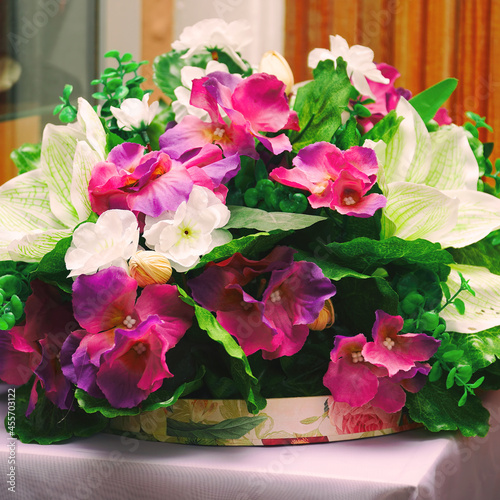 Wallpaper Mural Bouquet of beautiful artificial red and white flowers on a wooden wall background Torontodigital.ca