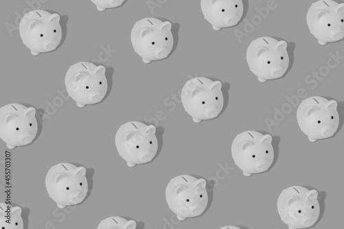 Cute pattern with a piggy banks on a dark background. Mnimal  black and white design