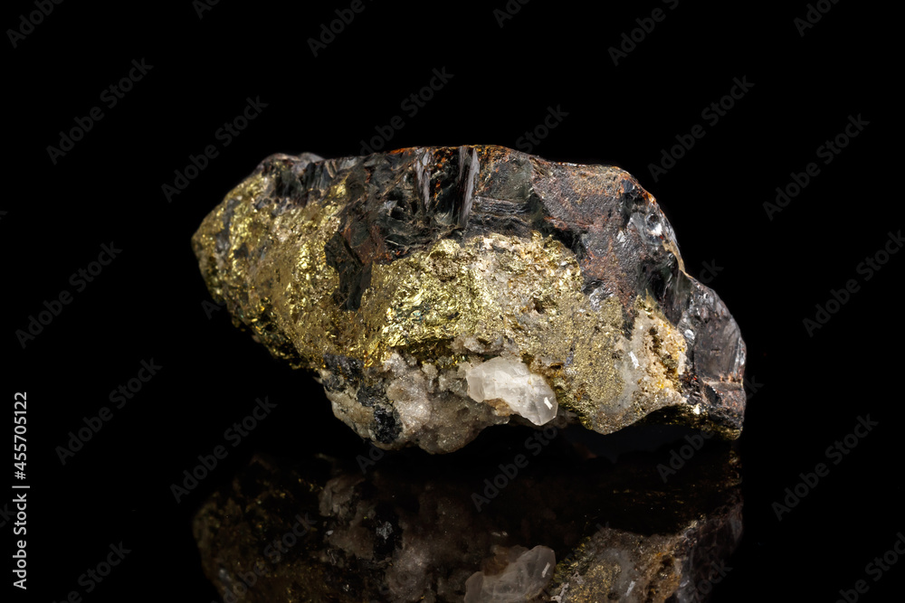 Macro of a mineral stone Sphalerite with fluorite and pyrite on a black background close up Macro of a mineral stone Sphalerite with fluorite and pyrite on a black background close up