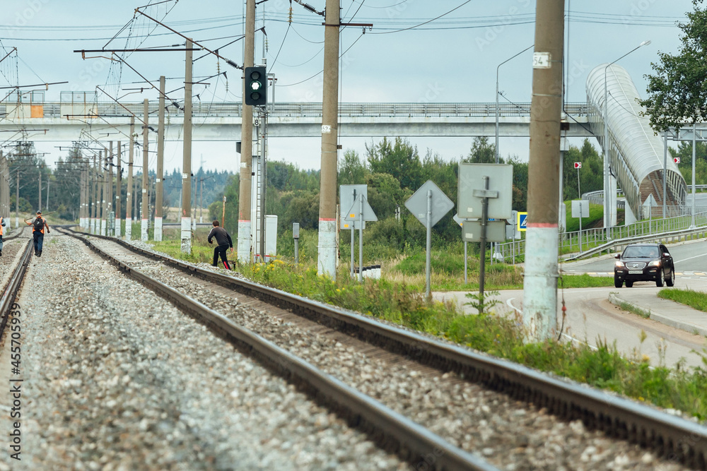 Fototapeta premium the railway tracks stretch into the distance to the horizon. gravel is poured on the sleepers between the rails. there are no trains on the tracks. railway transport highway