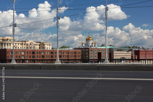 Monument to Prince Vladimir on Borovitskaya square. Orthodox cross in the rays of the setting sun. Baptism of Russia. photo