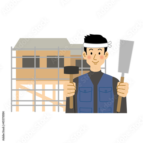 建築中の家と大工の男性
