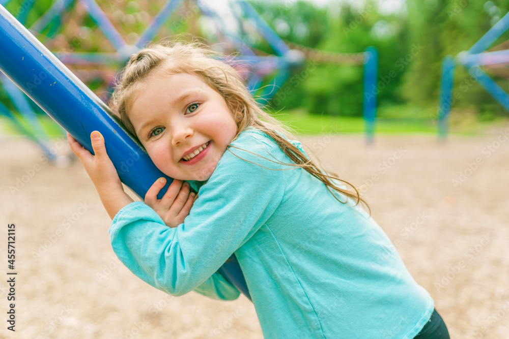 Happy little girl is playground having fun Happy little girl is playground having fun