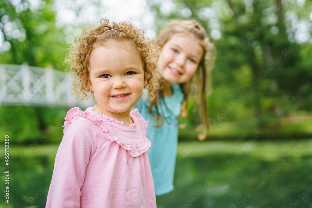 little sister in the summer on nature little girl little sister in the summer on nature little girl