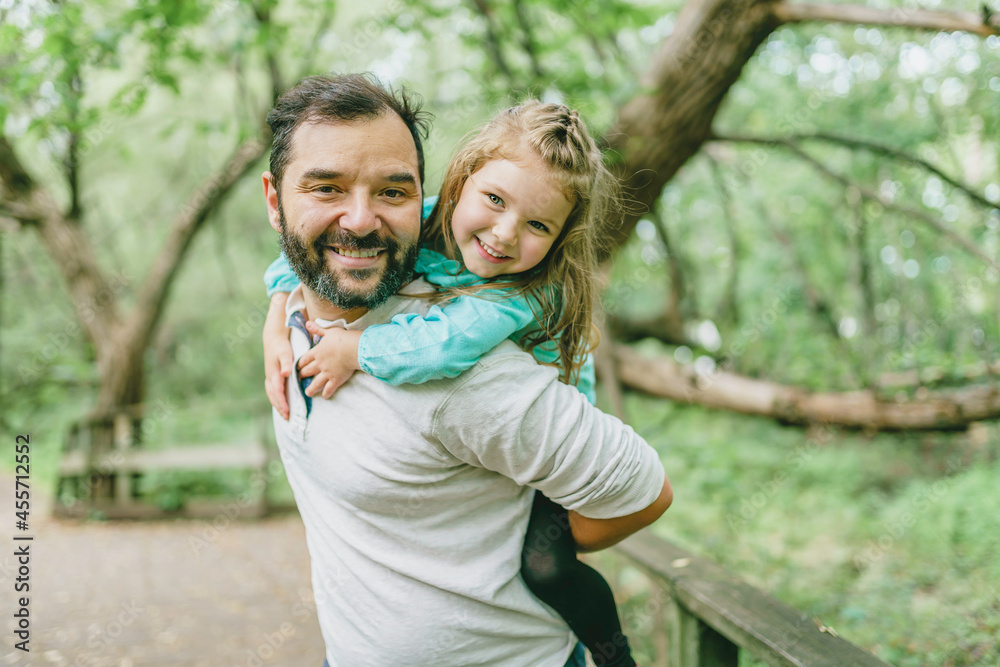 nice father having fun in summer forest with his child girl nice father having fun in summer forest with his child girl