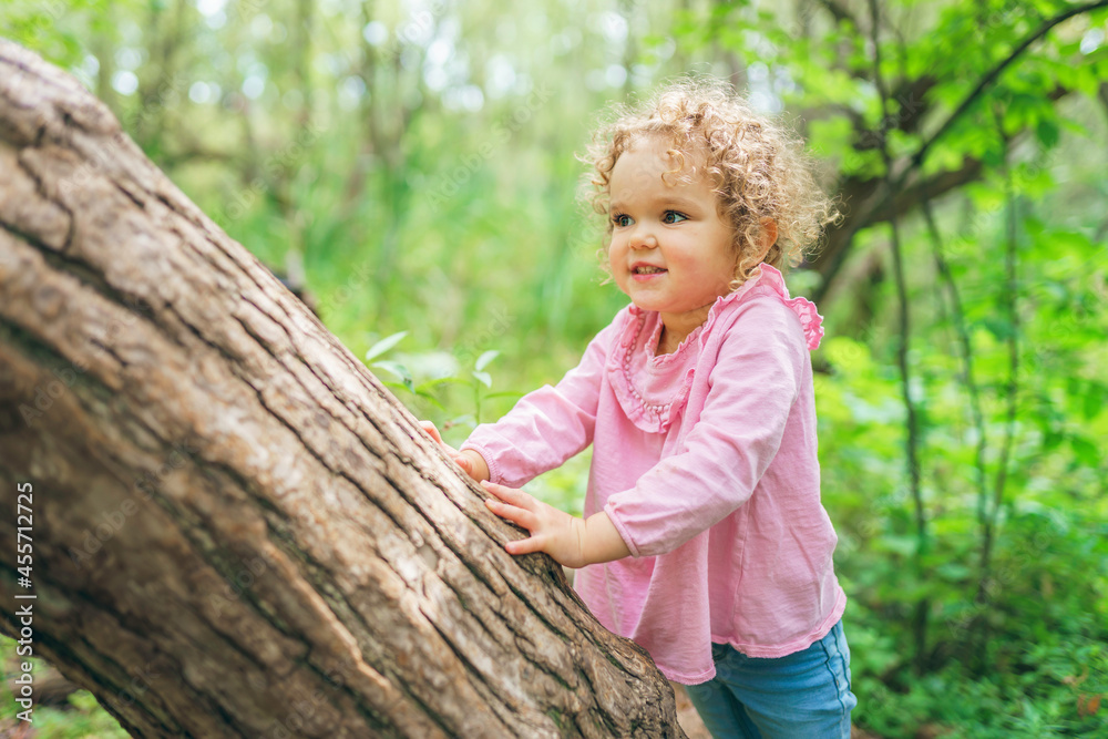 little girl on tree in the summer on nature little girl little girl on tree in the summer on nature little girl