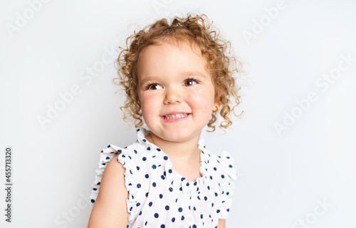 cute three year old caucasian girl posing isolated on white.