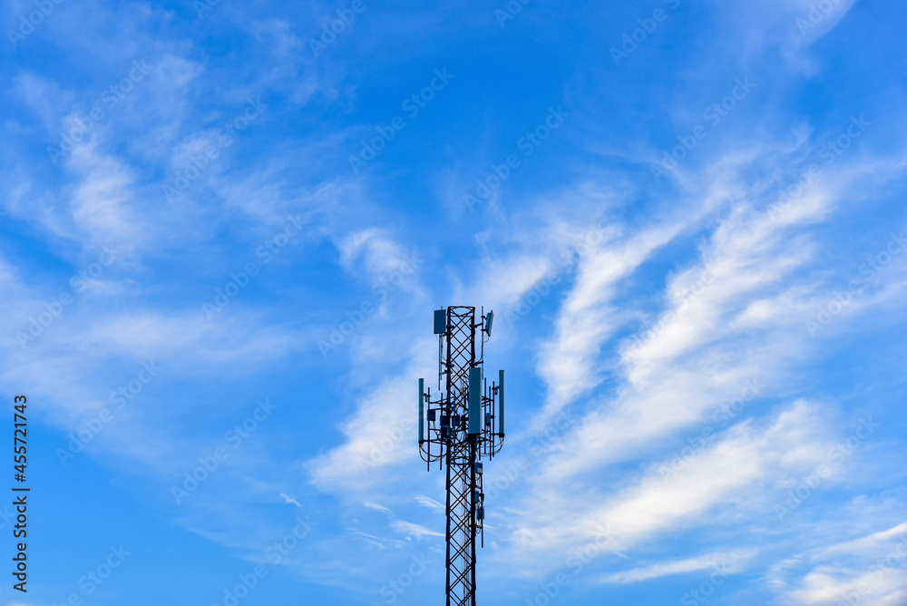 Telecommunication towers with clouds on blue sky background. Telecommunication towers with clouds on blue sky background.