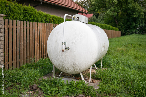Cuadro en lienzo Gas tank for heating the house at the fence. Heating system