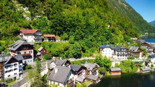 Hallstatt, Austria. Aerial view of the beautiful town from a flying drone over the lake in summer season. © jovannig