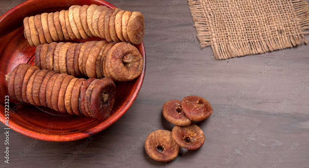 Fototapeta premium Fresh Figs or Anjeer fruit healthy vegan food concept organic dry fruits on wooden background.