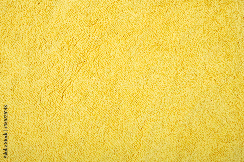 yellow fluffy cloth for cleaning as background and texture yellow fluffy cloth for cleaning as background and texture
