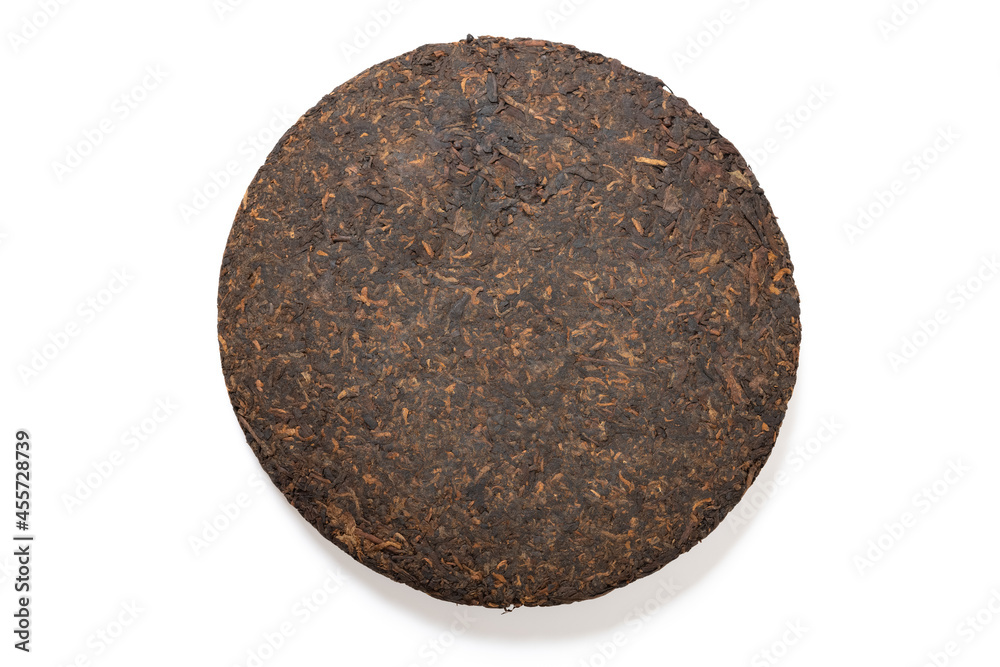 top view Puerh tea cake or Camellia sinensis var. assamica cake on white top view Puerh tea cake or Camellia sinensis var. assamica cake on white
