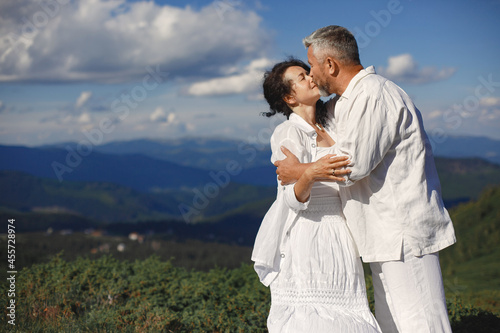 Adult couple walk in the mountains