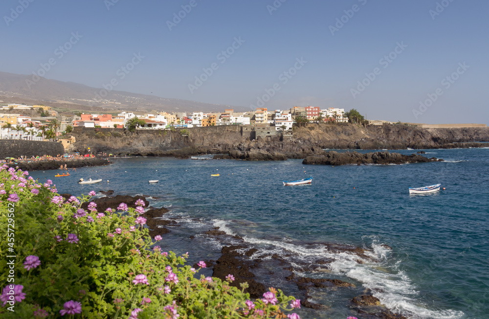 small village built on a rocky cliff by the blue sea on a summer day in the mediterranean sea
