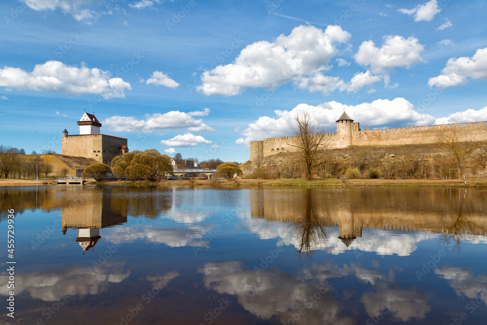 Narva Herman castle and Ivangorod fortress stand on banks of Narva river. Medieval fortifications on Estonian-Russian state border