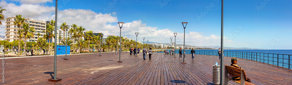 The Promenade of Limassol, panorama, tourists are enjoying Cypriot spring on the shores of the Mediterranean sea, Republic of Cyprus - obrazy, fototapety, plakaty 