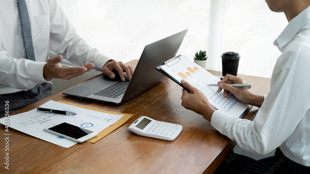 Business concept. Business people discussing the charts and graphs showing the results of their successful teamwork. Business concept. Business people discussing the charts and graphs showing the results of their successful teamwork.