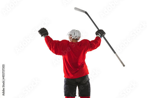 Cropped portrait of male professional hockey player in special uniform isolated over white background. Back view