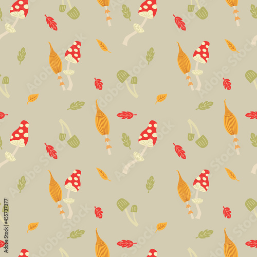 Autumn mushrooms with colorful leaves. Seamless illustration with amanita and toadstools. Fabric, background or wallpaper.