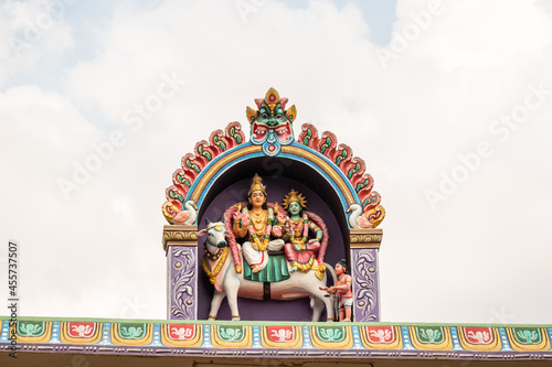 A colorfully decorated roof with mythological figures and deities in an an ancient Hindu temple in Tamil Nadu.