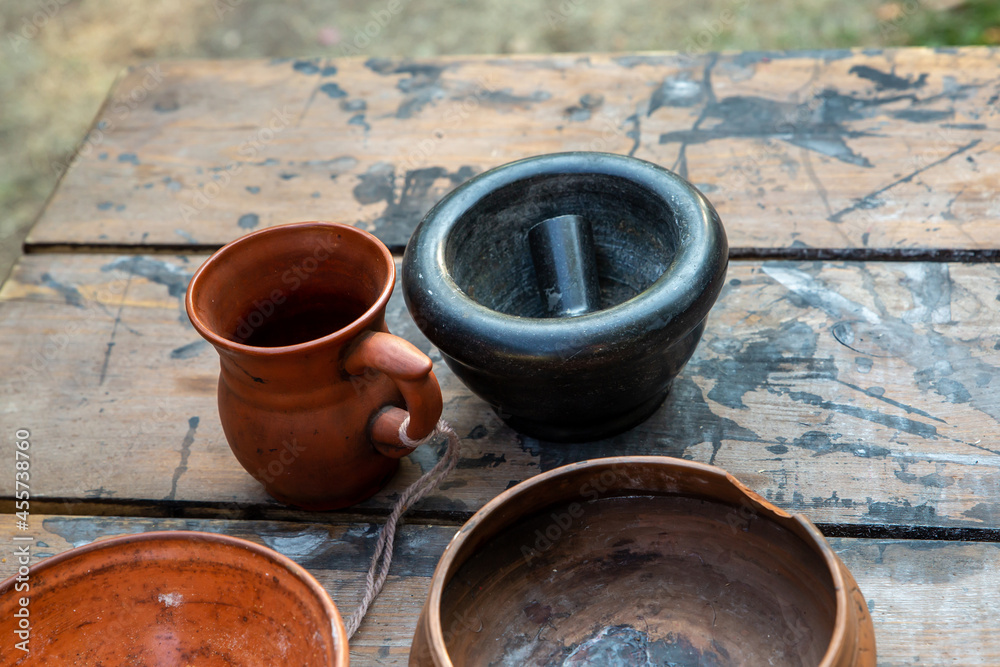 crockery jug earthenware mug and mortar on the table traditional crockery jug earthenware mug and mortar on the table traditional