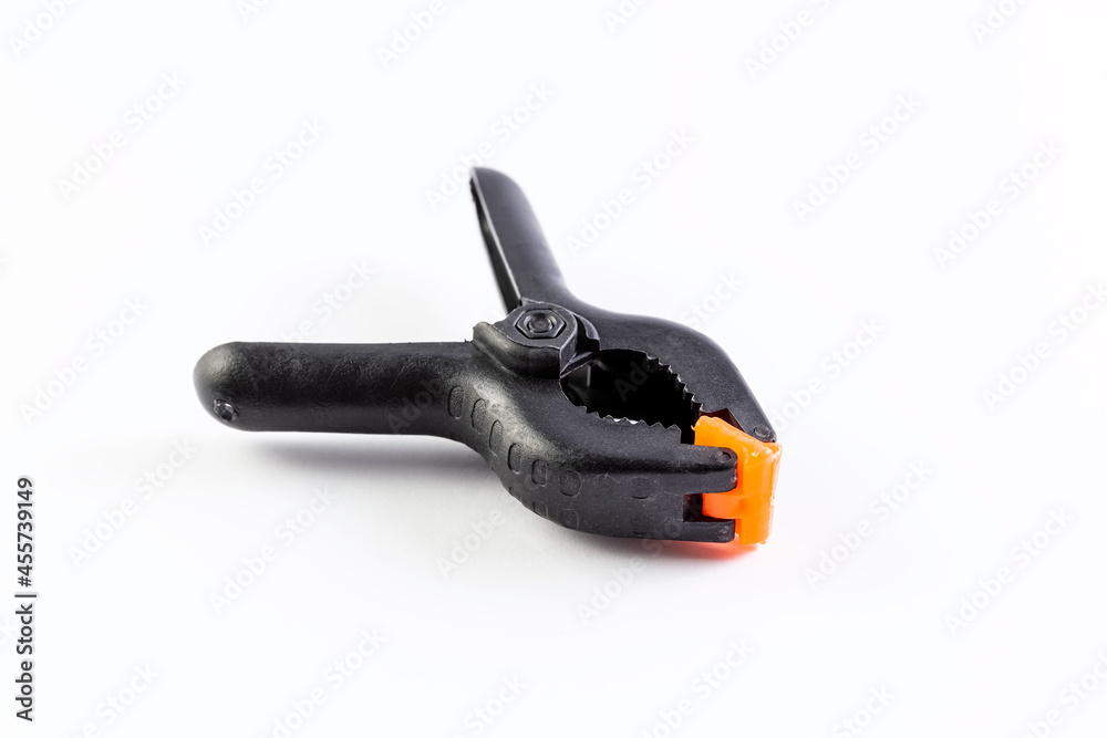 Plastic clip for a photophone on a white background. Photo studio accessory. Isolate. Plastic clip for a photophone on a white background. Photo studio accessory. Isolate.